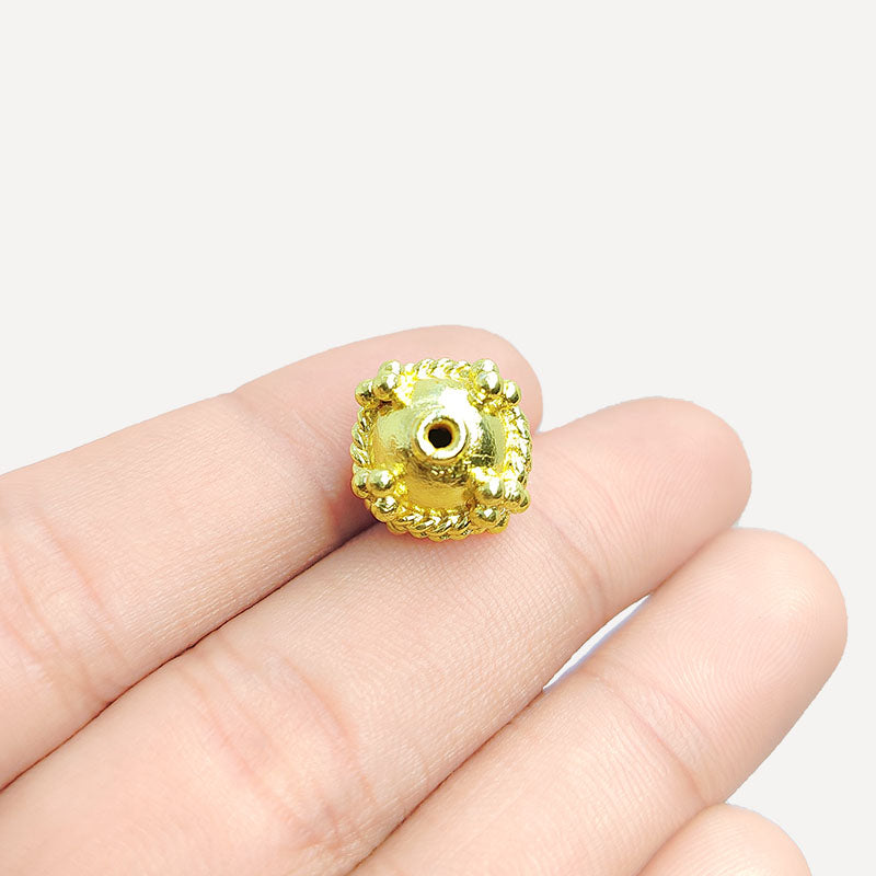 Handcrafted 18K gold overlay copper bead with granulated dots and rope-border design from India for jewelry making.