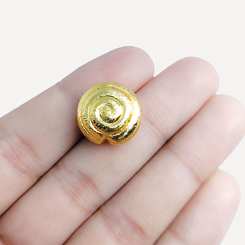Handcrafted 18K gold overlay copper coin bead with brushed spiral design from India for jewelry making.