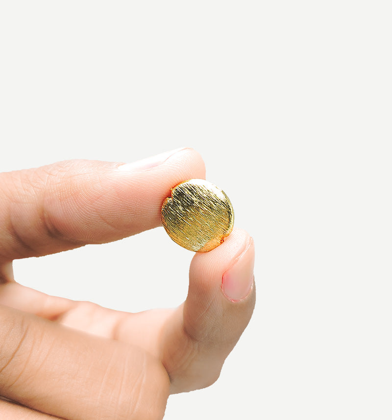 Handcrafted 18K gold overlay brushed coin-shaped copper bead with notch design from India.