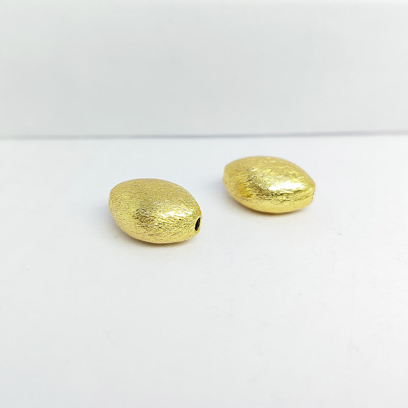Handcrafted 18K gold overlay brushed oval barrel bead made from copper in India.