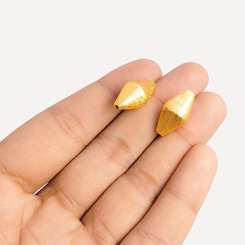 Handcrafted diamond-shaped bead with 18K gold overlay over copper, ideal for DIY jewelry making.