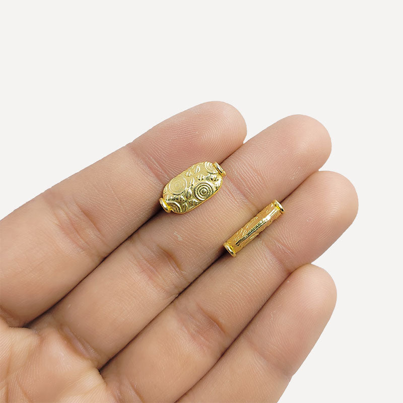 Elegant handcrafted oval barrel bead made from 18K Gold Overlay Over Copper in India with decorative engraved detailing.