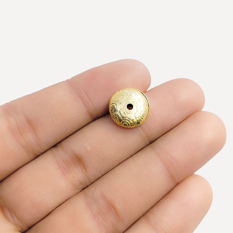 Elegant handcrafted round bead with engraved spiral design made from 18K Gold Overlay Over Copper in India.