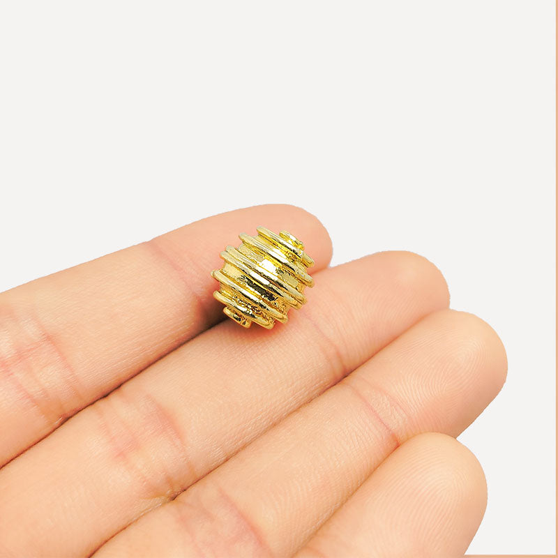 Ridged round jewelry bead with 18K gold overlay over copper handcrafted in India