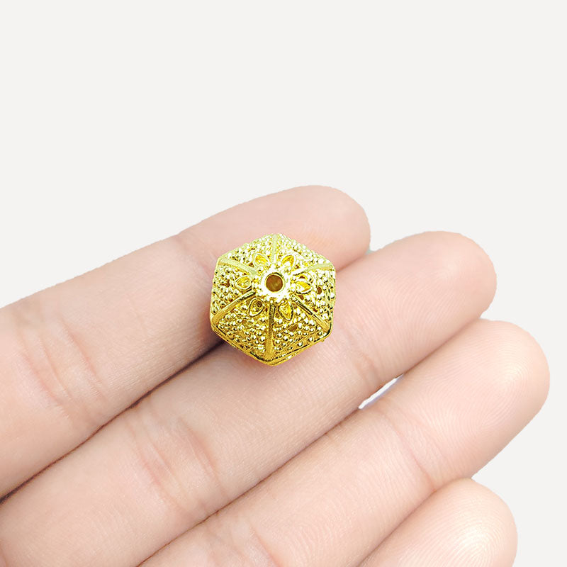 Faceted hexagon jewelry bead with 18K gold overlay over copper handcrafted in India