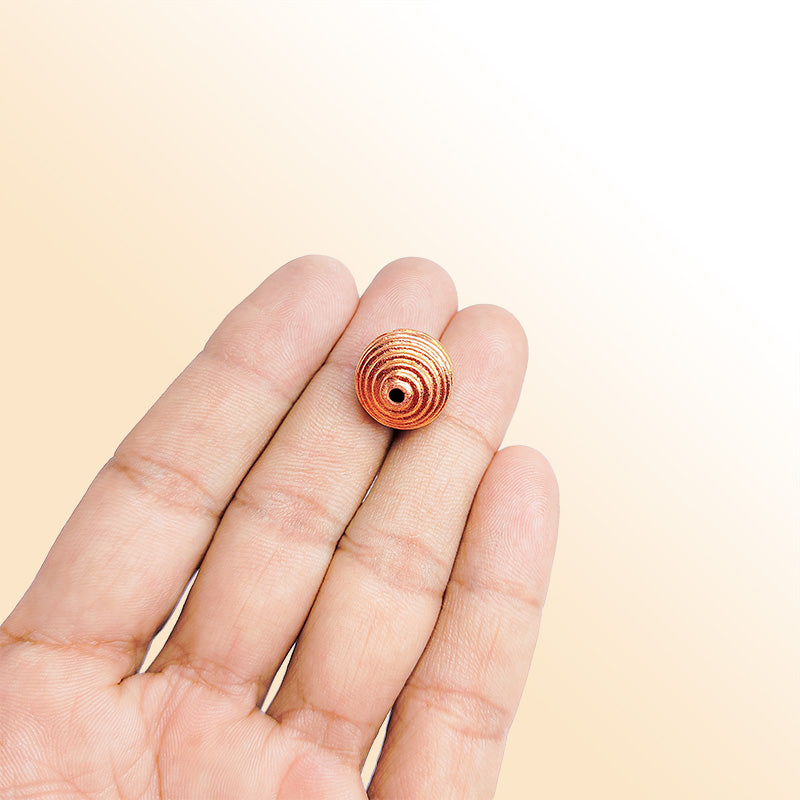 Handcrafted rose gold overlay copper ribbed round bead made in India with brushed finish