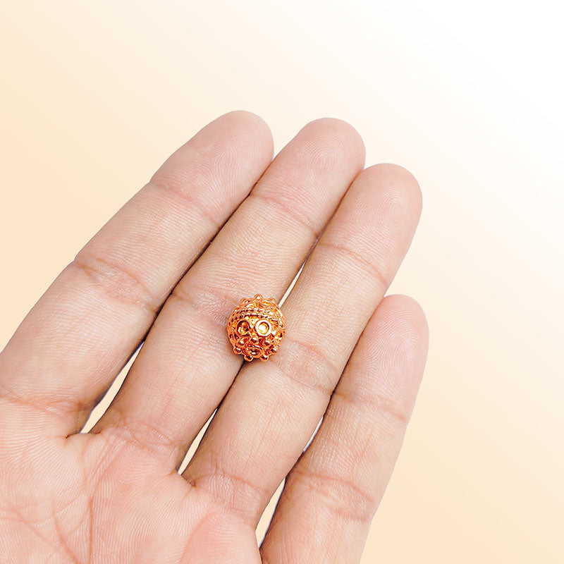 Rose gold ornate copper bead handcrafted in India with raised dotted detailing and polished finish