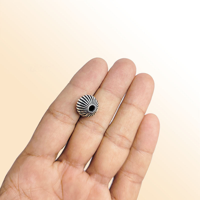 Silver ribbed round copper bead handcrafted in India with antique finish and textured surface