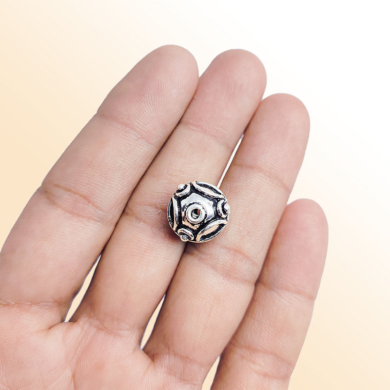 Silver studded round copper bead handcrafted in India with antique finish and raised detailing