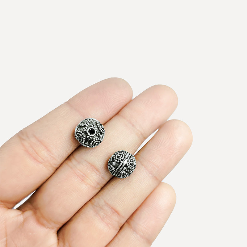 Handcrafted silver overlay round bead from India with oxidized finish and spiral dot design for retail jewelry making