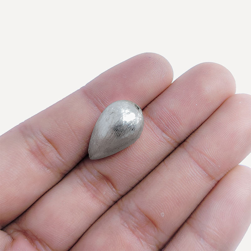 Elegant silver and copper teardrop shaped decor handcrafted in India with silver overlay finish