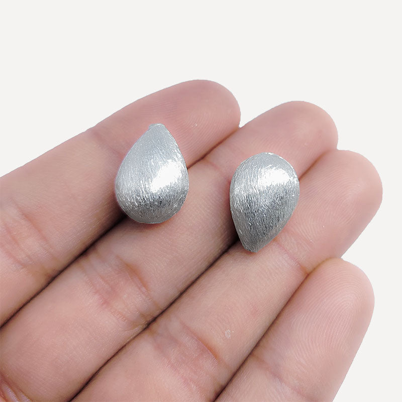 Elegant silver and copper pear shaped decor accent handcrafted in India with textured silver finish