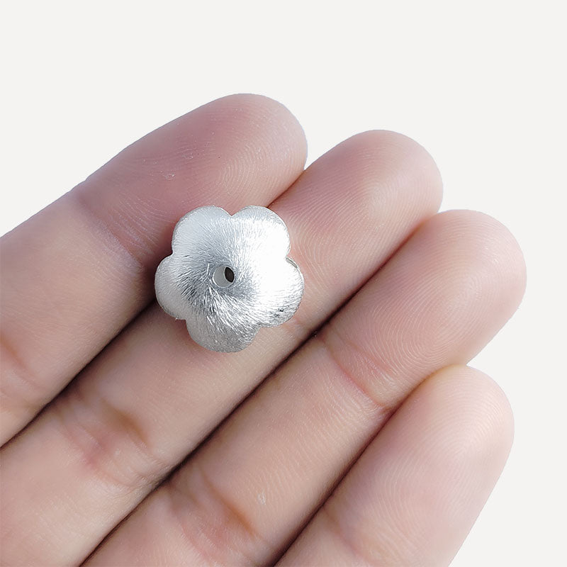 Elegant silver and copper flower shaped decor bead handcrafted in India with textured silver finish