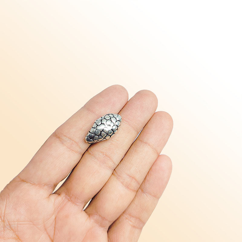 Silver oval bead cap from India with pebble textured design, handcrafted using silver overlay over copper.