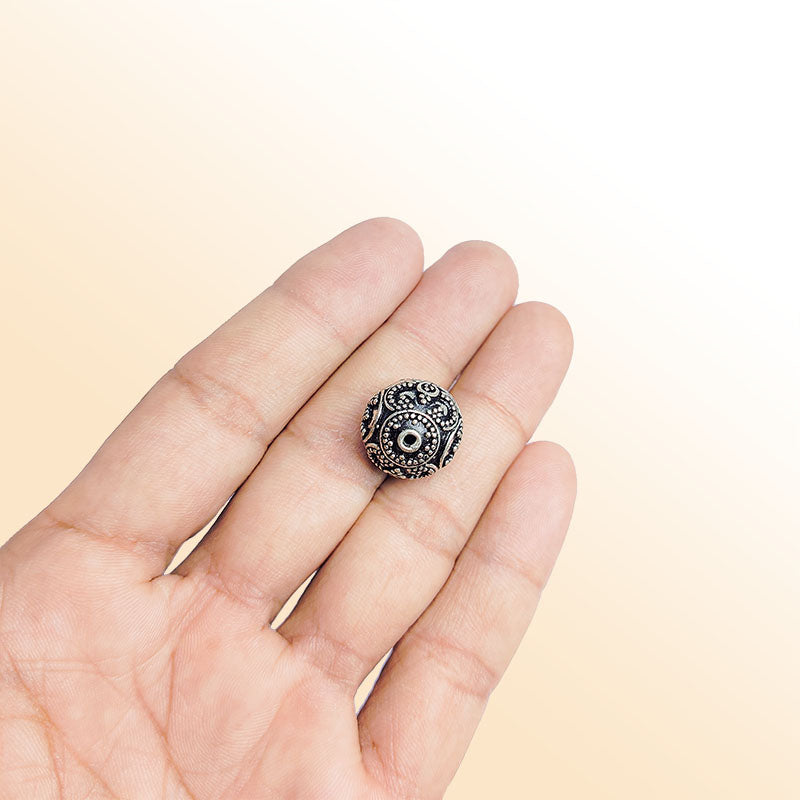Granulated silver overlay over copper round bead handcrafted in India with dotted detailing
