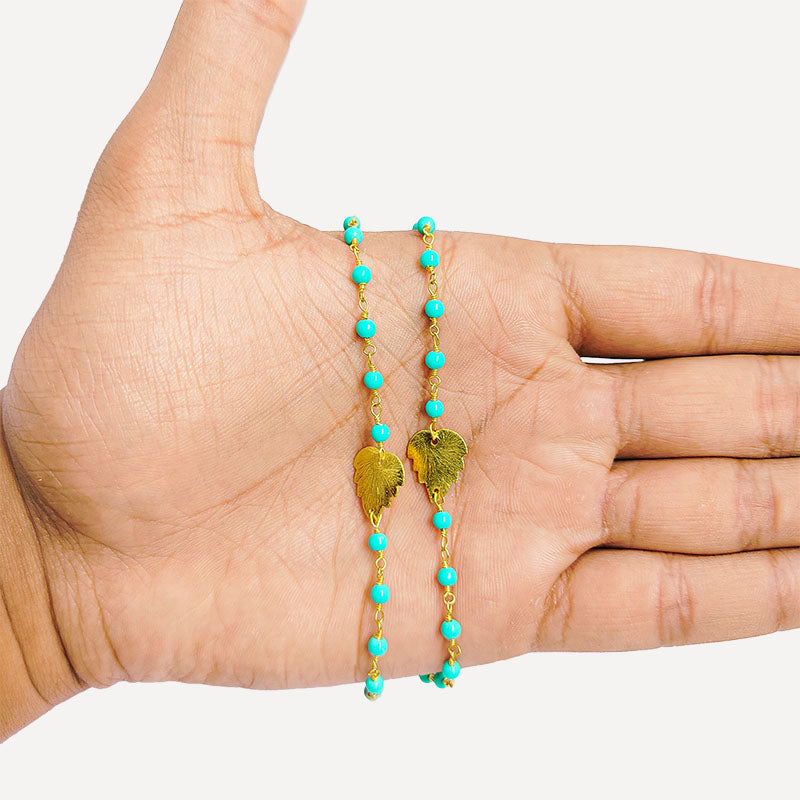 Elegant turquoise shell beaded necklace with leaf motif accents and smooth 18K Gold Overlay Over Copper designed for everyday and festive wear