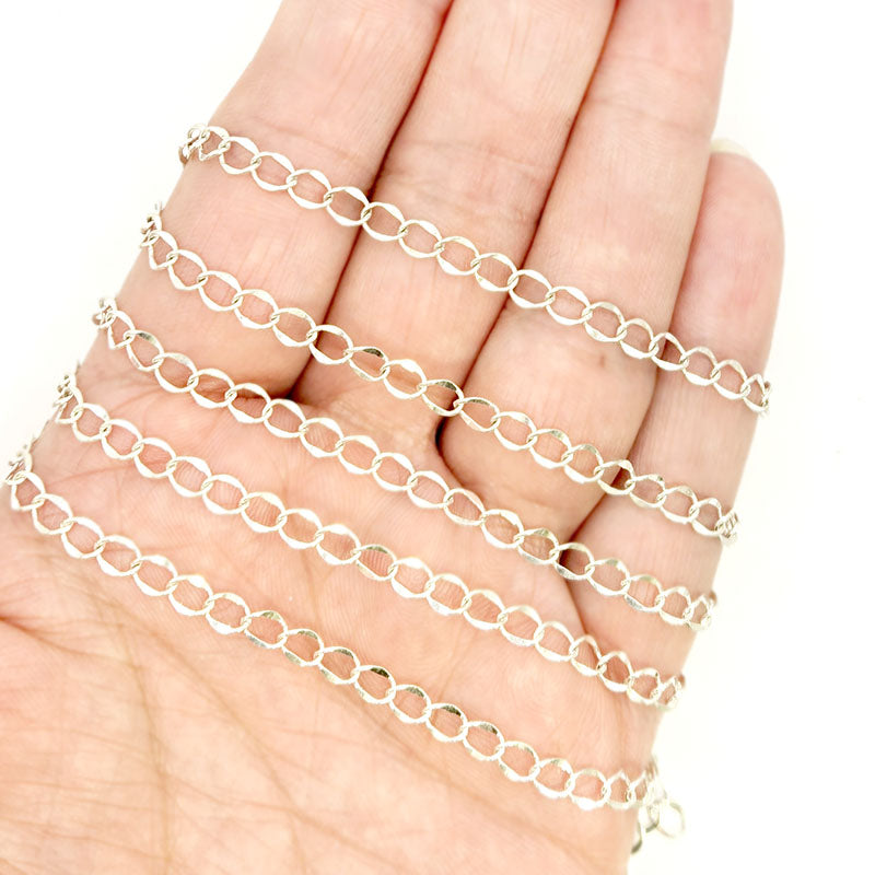 Silver overlay over copper oval link chain with polished finish and elegant smooth links displayed on white background for retail jewelry use