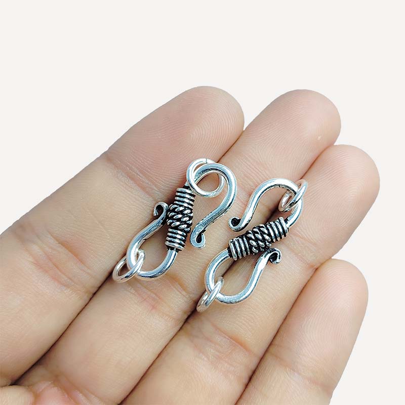 Silver overlay over copper S hook from India handcrafted with textured wrap design and oxidized silver finish