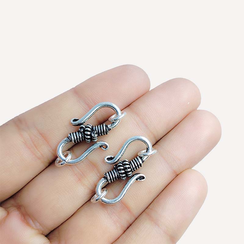 Silver Overlay Over Copper artisan swirl S hook clasp handmade in India with antique oxidized finish.