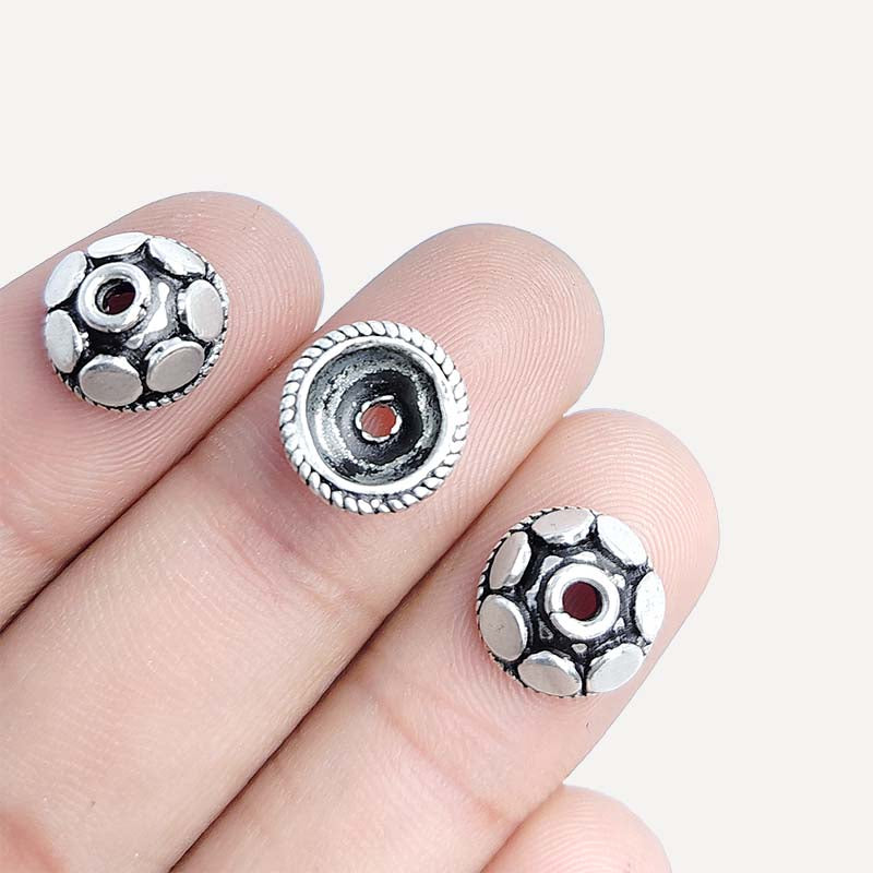 Silver Overlay Over Copper India heavy round dome bead cap with embossed oval pattern and antique oxidized finish.