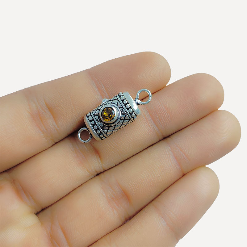 Silver Overlay Over Copper clasp with round amber-colored stone handcrafted in India with vintage oxidized detailing.