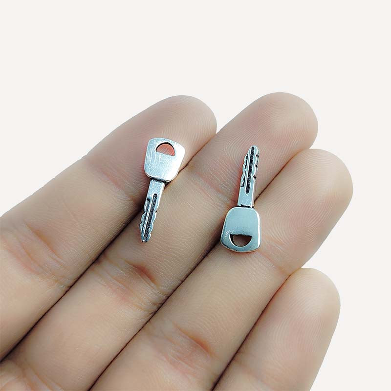 Silver Overlay Over Copper little key charms handcrafted in India with vintage oxidized detailing.