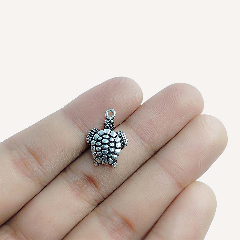 Silver Overlay Over Copper turtle pendant handcrafted in India with vintage oxidized detailing.
