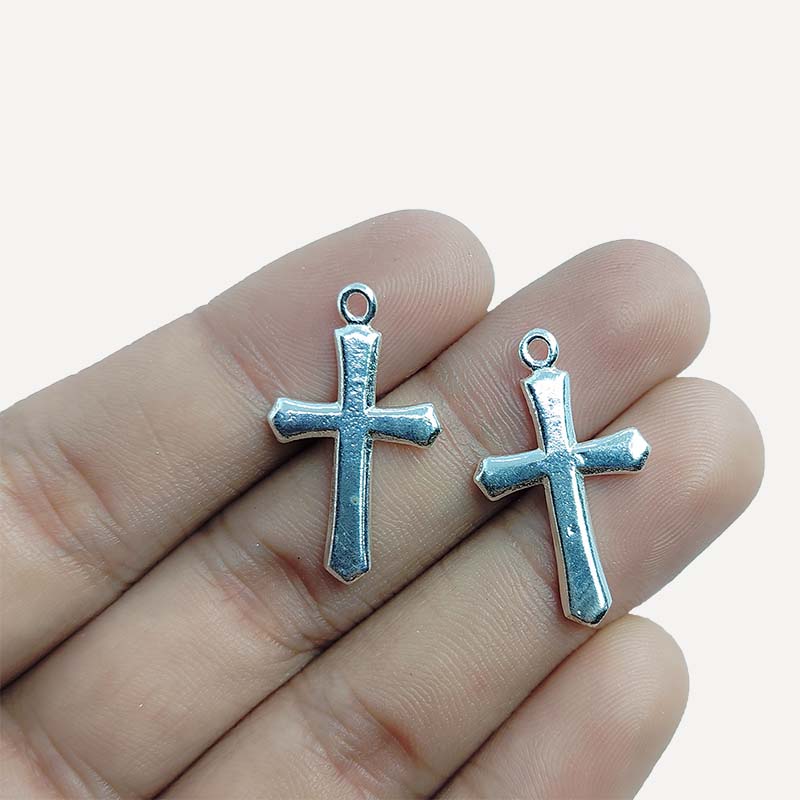 Handcrafted silver overlay over copper cross charm pendant from India with simple minimalist design
