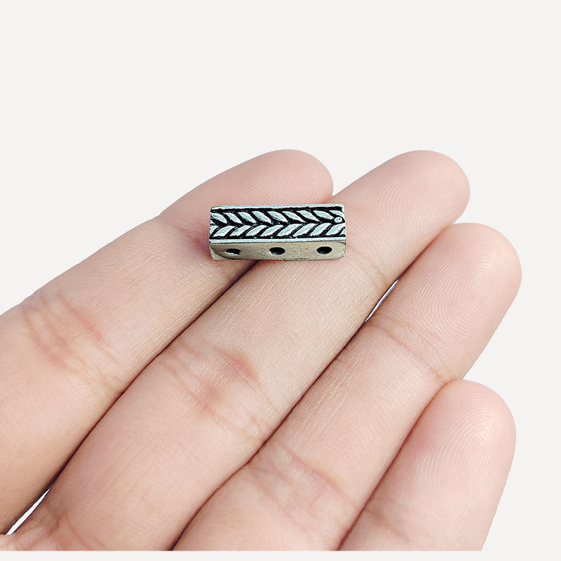 Handcrafted silver overlay over copper chevron spacer bar with three holes from India for jewelry making
