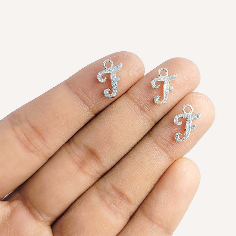 Silver overlay over copper alphabet F Charm with script design, handcrafted in India for personalized jewelry