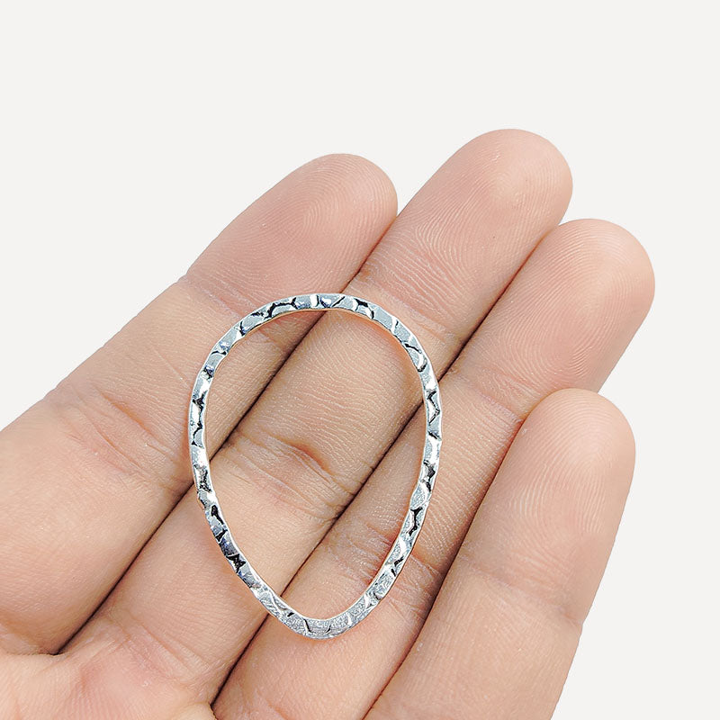 Handcrafted Silver Overlay Hammered Oval Connector from India with polished silver overlay finish