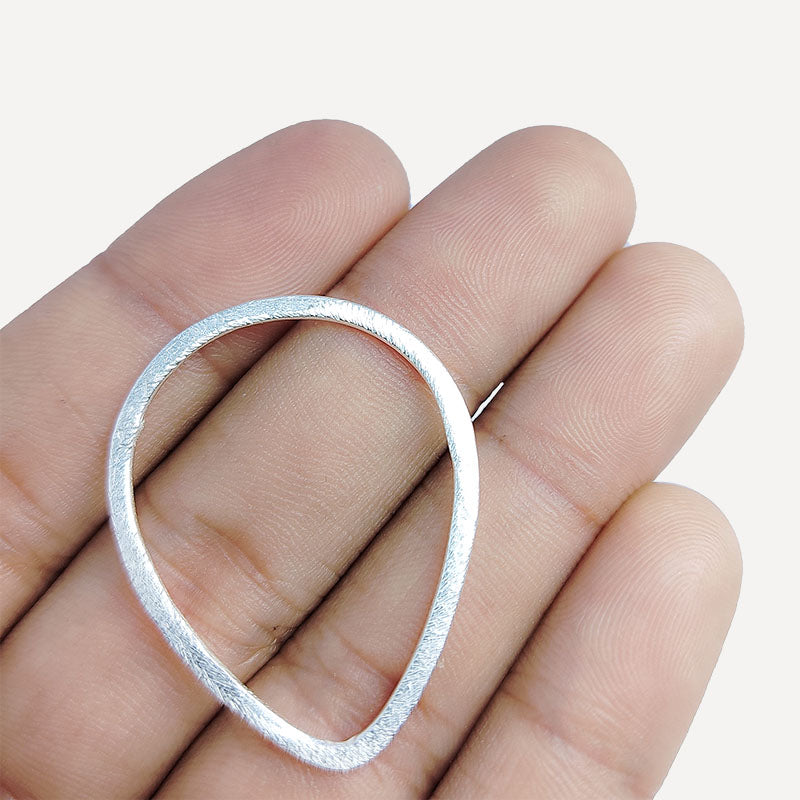 Handcrafted Silver Overlay Textured Teardrop Connector from India with polished silver overlay finish