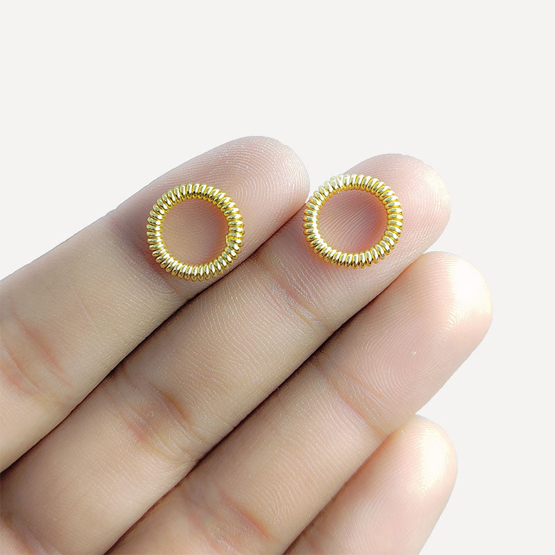 Elegant 18K Gold Overlay Copper coiled spring jewelry ring with tightly wound circular pattern and polished gold finish, handcrafted in India for DIY jewelry making and creative designs.