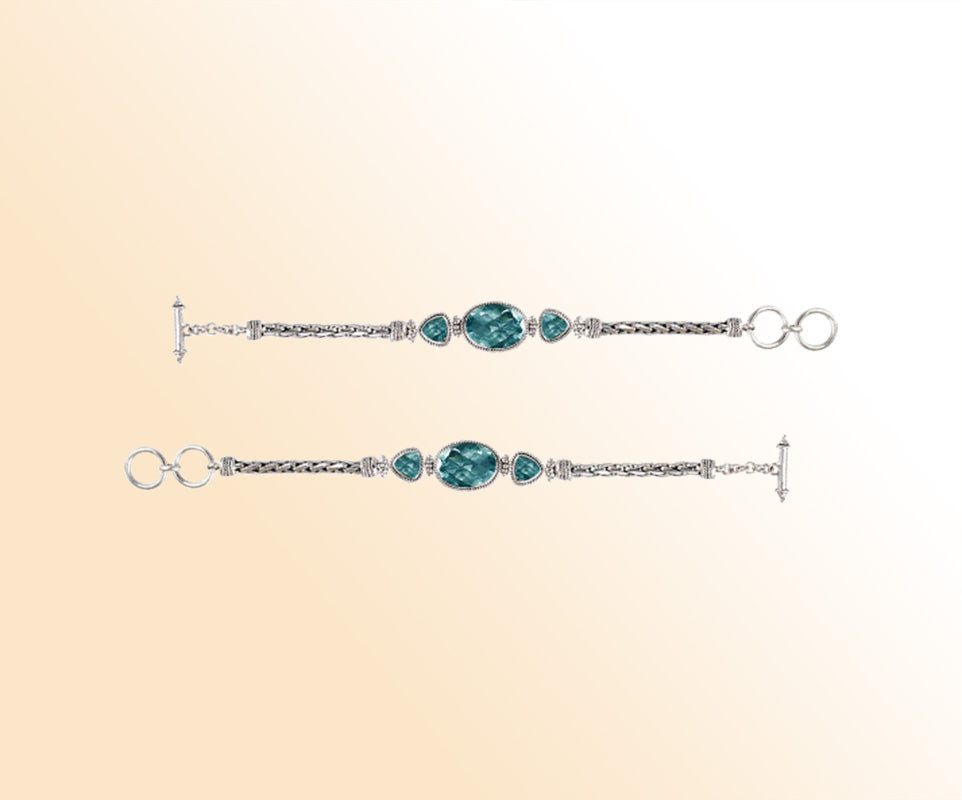 Handcrafted Sterling Silver Bracelet Featuring Blue Topaz Quartz Oval And Trillion Stones With Woven Chain Links