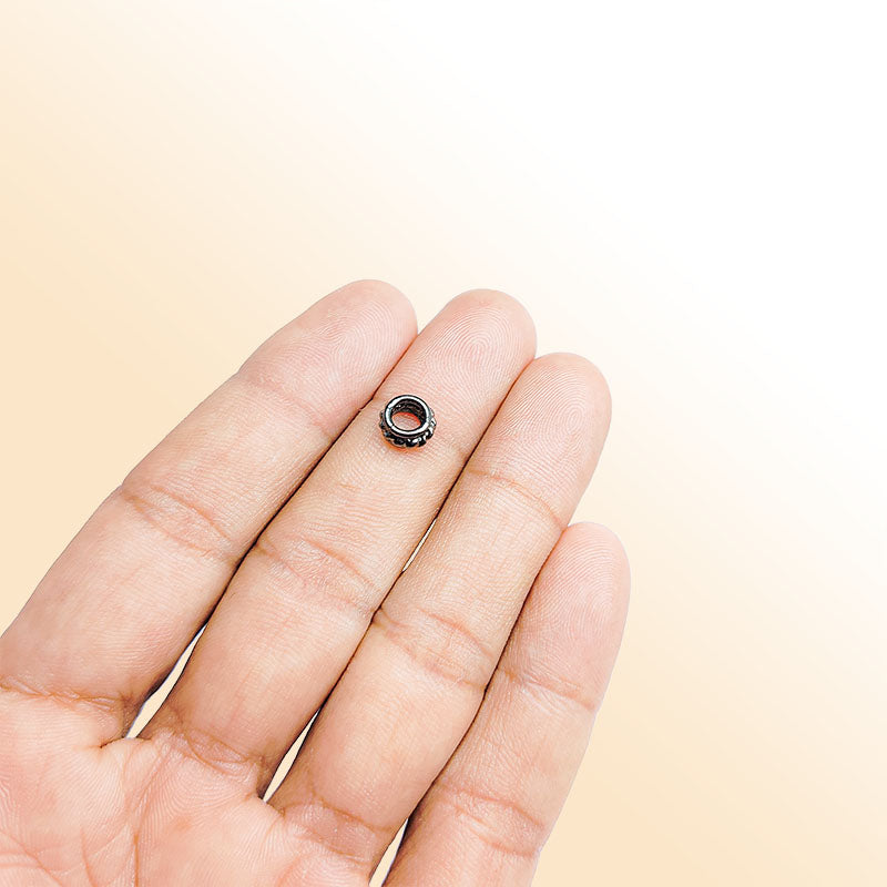 Handcrafted black rhodium overlay ribbed floral copper spacer bead from India for modern jewelry designs