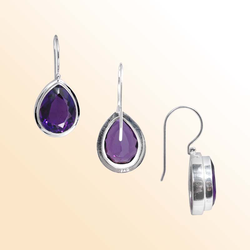 Handcrafted Sterling Silver earrings featuring pear-cut Amethyst Quartz in a polished bezel frame with elegant hook design.