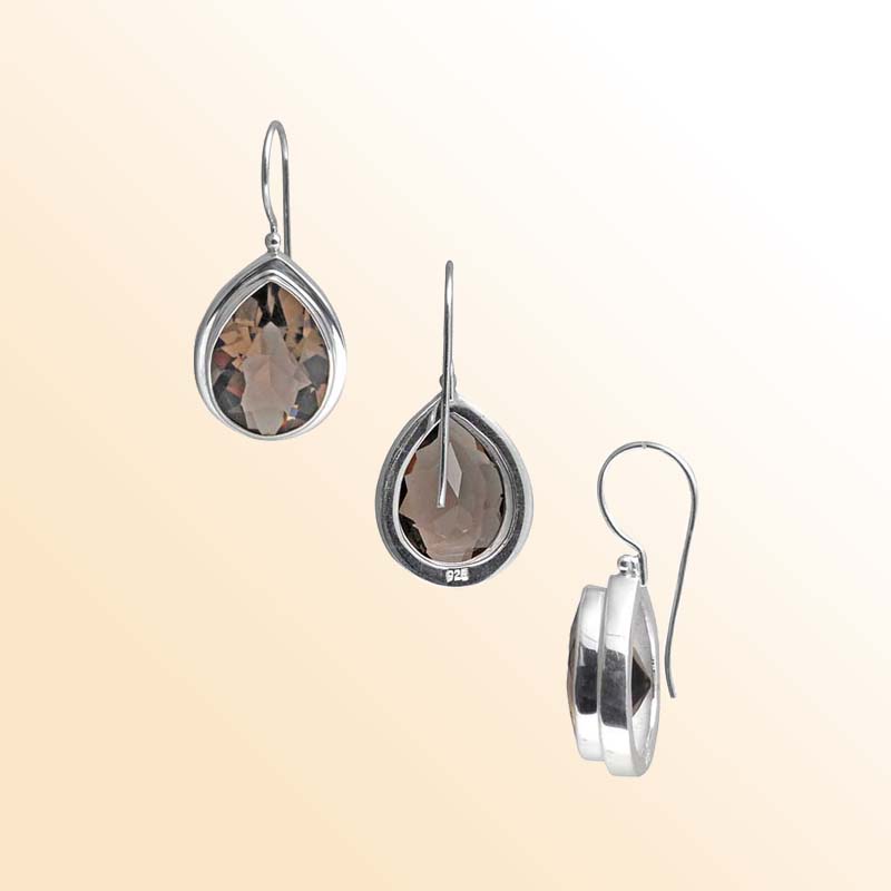 Handcrafted Sterling Silver earrings with pear-cut Smoky Quartz featuring a polished bezel frame and elegant hook design.