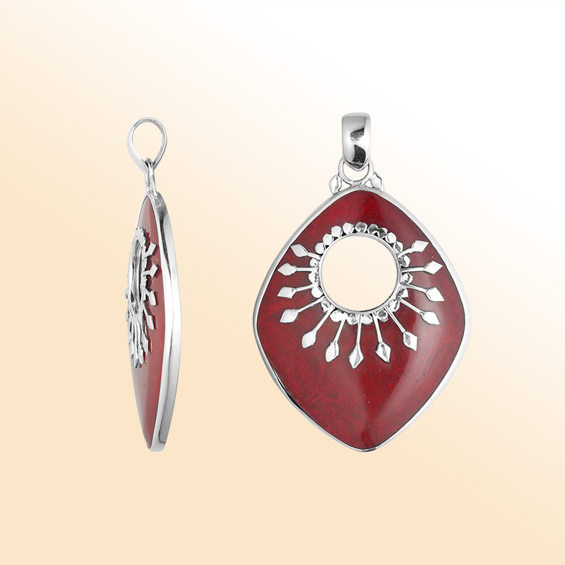 Handcrafted Sterling Silver Shield-Shaped Pendant With Red Coral And Sunburst Medallion.