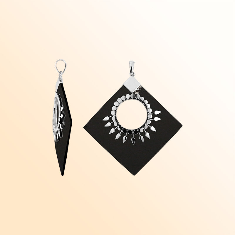 Handcrafted Sterling Silver Diamond Pendant With Black Shell And Sunburst Medallion.