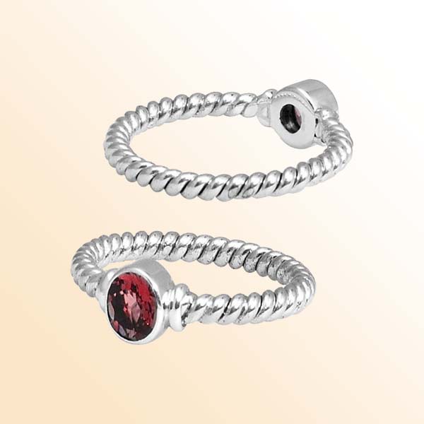 Sterling silver passion rope ring with bezel-set Garnet Quartz, handcrafted in Bali.