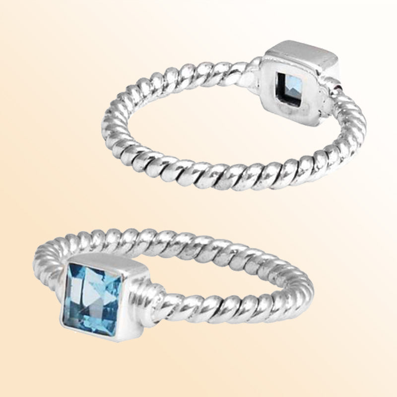 Sterling silver tranquil rope ring with square Blue Topaz Quartz, handcrafted in Bali.