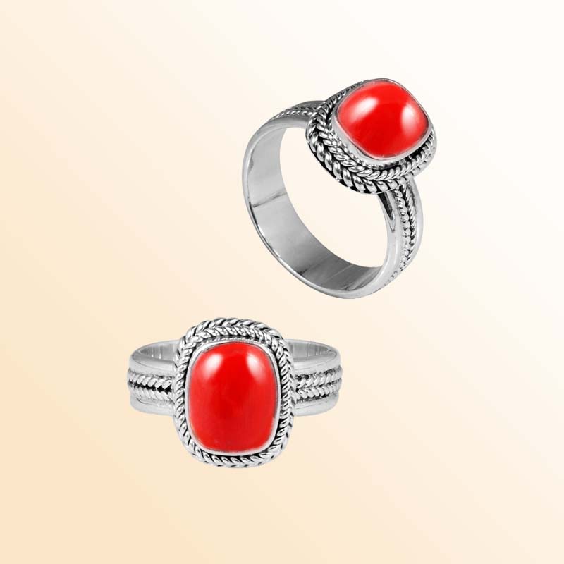 Handcrafted sterling silver Red Coral cushion ring with braided Bali rope frame