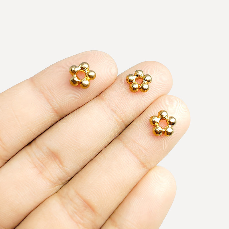 Handcrafted rose gold flower spacer beads made of copper with polished finish from India