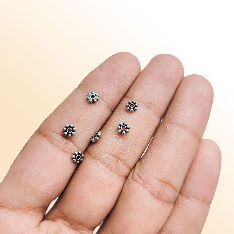 Floral spacer bead with center hole, Silver Overlay Over Copper, handcrafted in India for elegant jewelry designs.