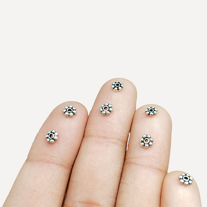 Floral spacer bead with center hole, Silver Overlay Over Copper, handcrafted in India for elegant jewelry designs.
