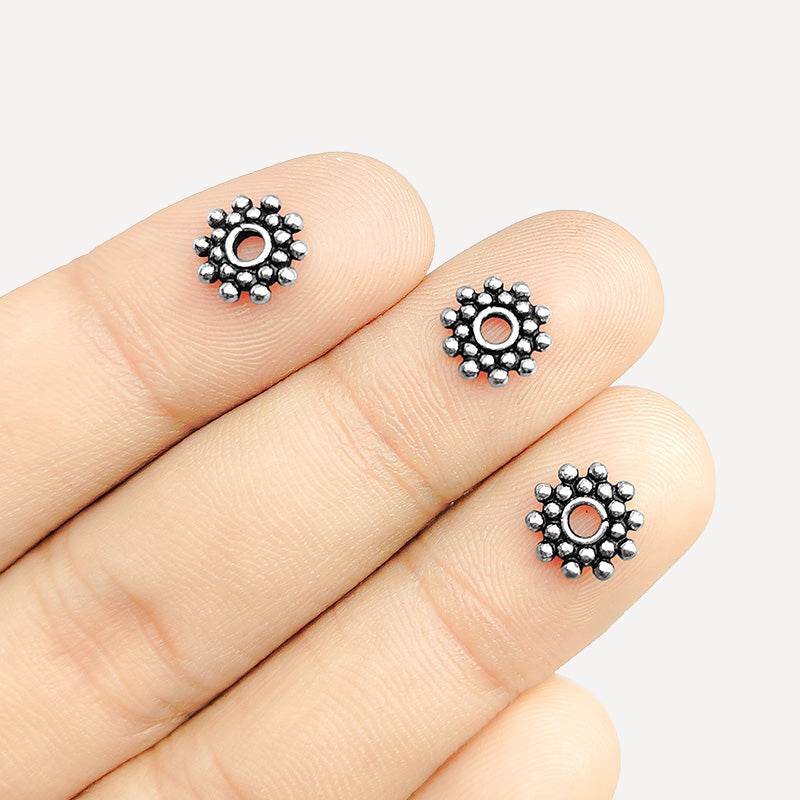 Silver overlay over copper round cluster spacer beads handcrafted in India with circular bubble design and polished finish.