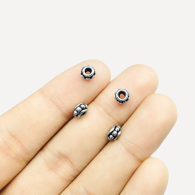 Silver Overlay Over Copper petite floral spacer charm, handcrafted in India for handmade jewelry designs.