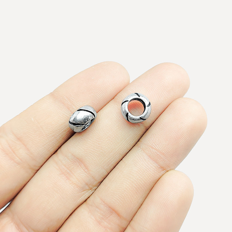 Silver Overlay Over Copper swirl texture spacer charm, handcrafted in India for handmade jewelry designs.