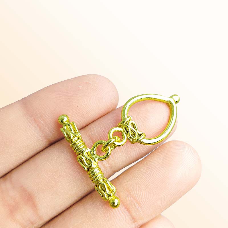 Handmade 18K gold overlay toggle clasp with ornate decorative bar and teardrop loop, crafted in India for bracelets and necklaces
