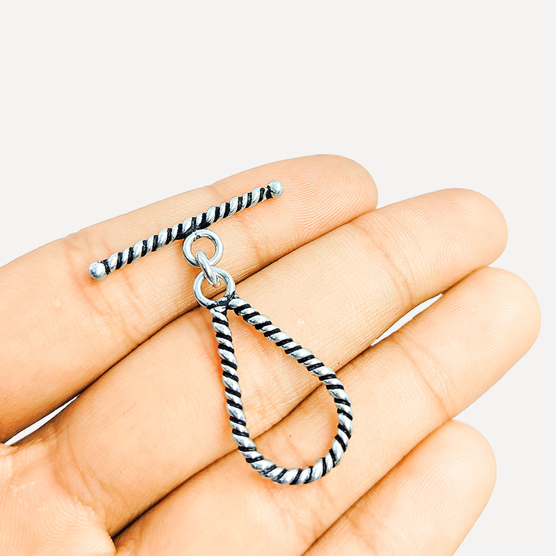 Elegant Silver Overlay teardrop rope toggle clasp with twisted loop and polished bar design, perfect for necklaces and bracelets, handcrafted in India.